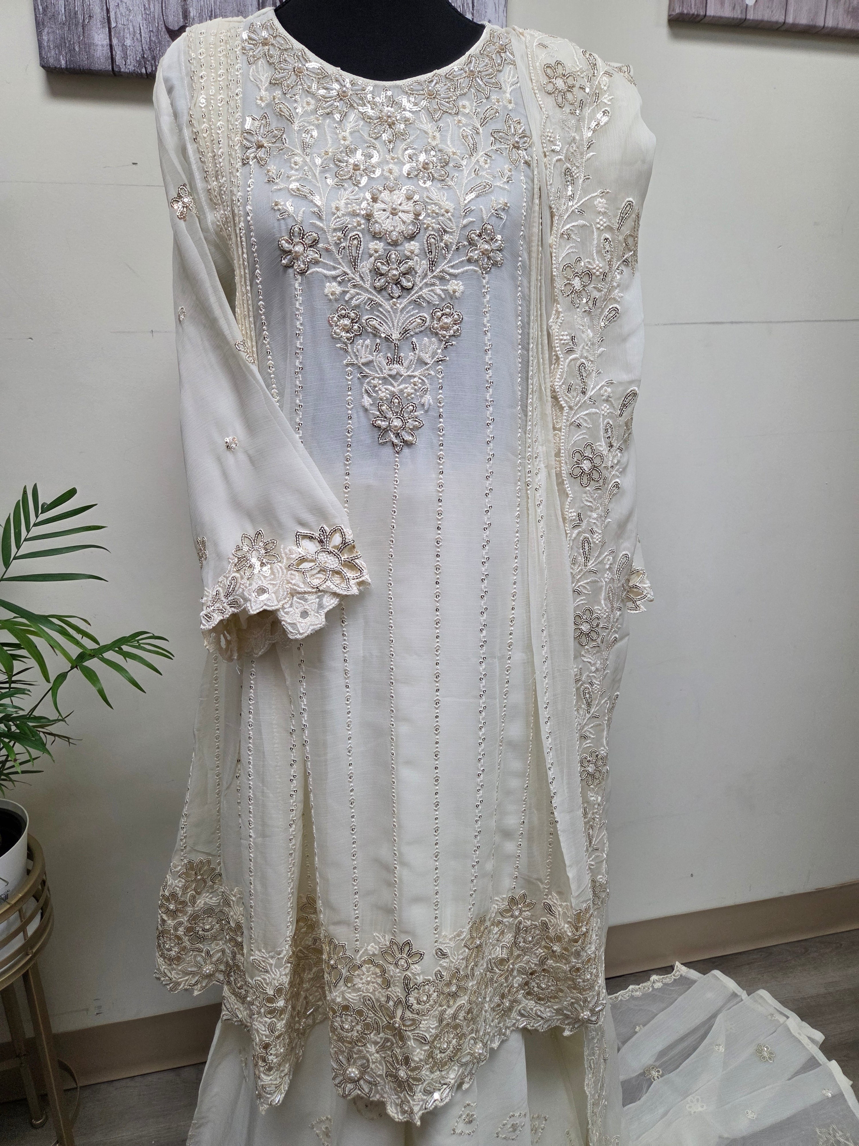 Elegant Chiffon Pleated Short Frock & Intricate Cutwork Palazzo Set - Boutique By MaryamBoutique By MaryamBoutique By MaryamOff - WhiteSElegant Chiffon Pleated Short Frock & Intricate Cutwork Palazzo Set